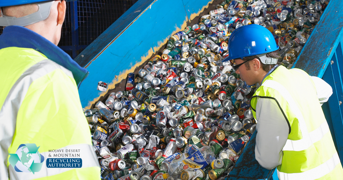 Aluminum recycling line with workers looking on.