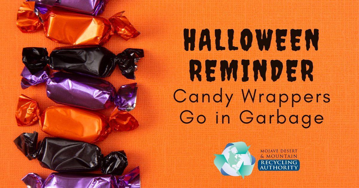 Candy in wrappers on an orange background