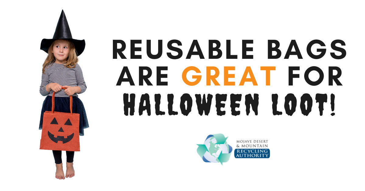 Girl dressed as a witch with a reusable jack-o-lantern bag