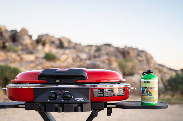 Image of Little Camper Refillable 1lb propane cylinder on a BBQ in the Joshua Tree Desert