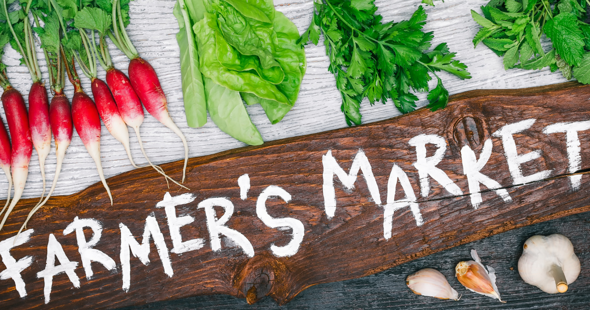 Image of the words”farmer’s markets” with some veggies