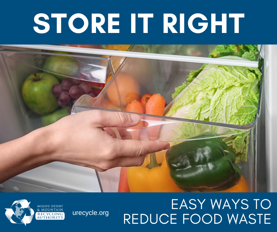 A hand pulls out a veggie drawer in a fridge