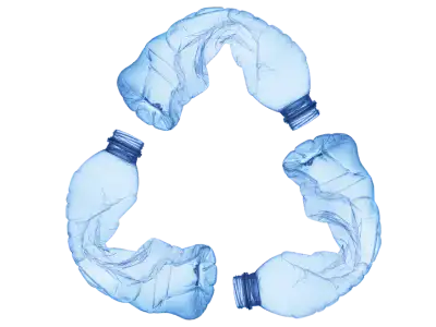 Crushed plastic bottles form a recycle symbol
